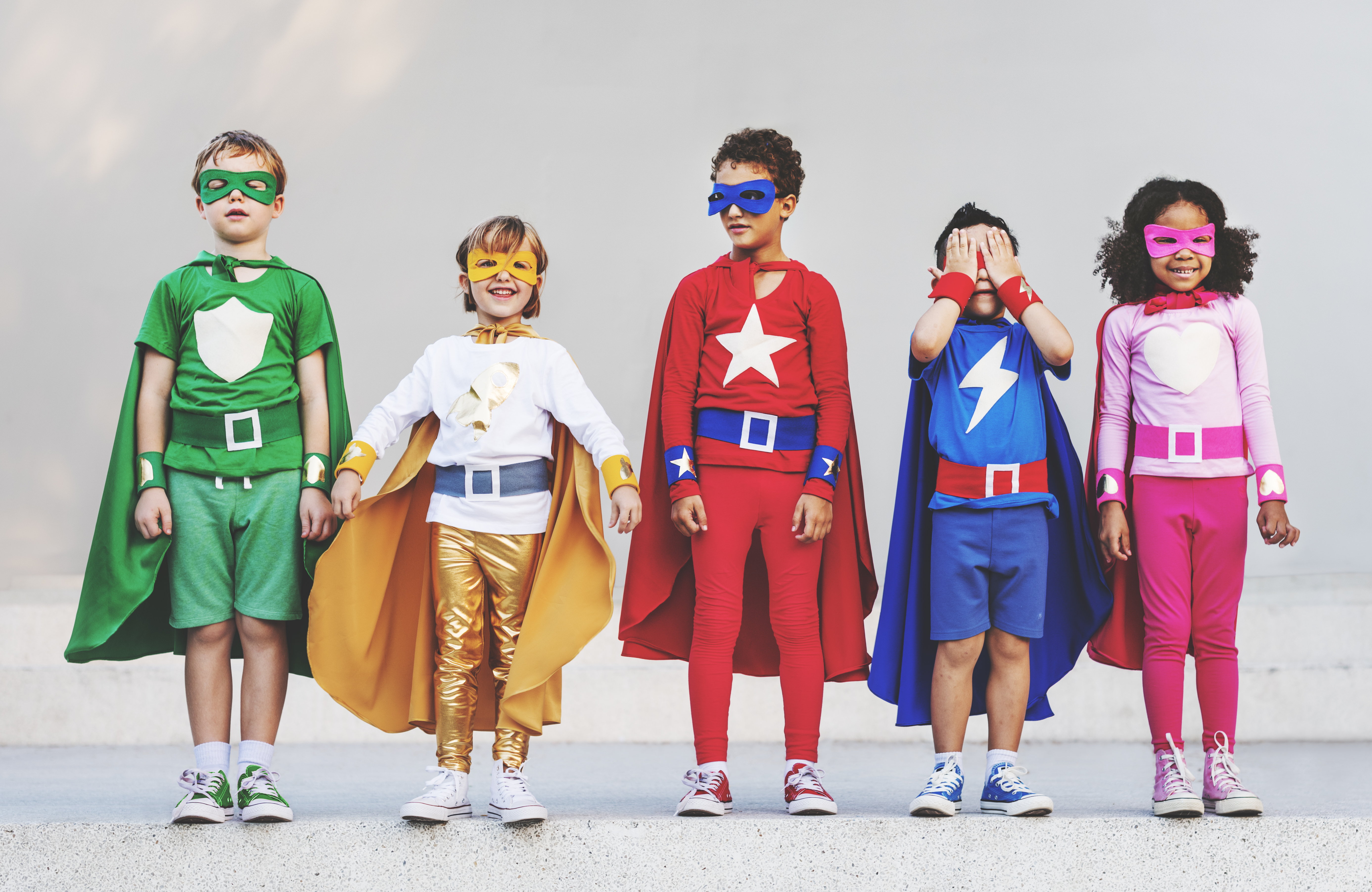 Superhero kids in costumes.